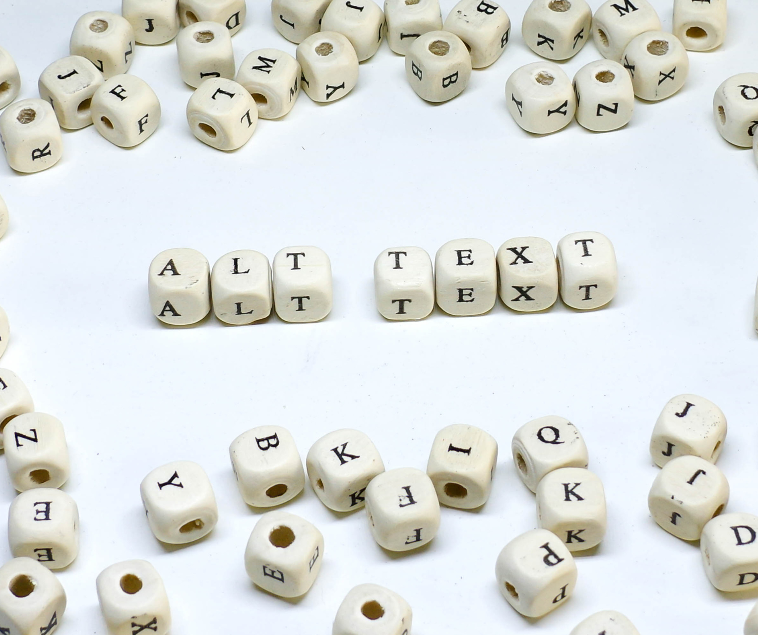 Photo of dice spelling out Alt Text