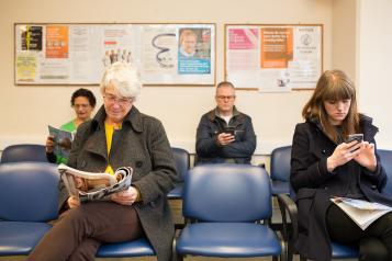 Patients sat in GP waiting room